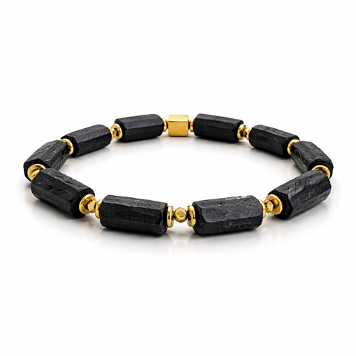 Męska bransoletka NOiR z surowego czarnego turmalinu i złotego hematytu. Biżuteria intencjonalna symbolizująca siłę, ochronę i stabilność. Ręcznie wykonana. Edycja limitowana.